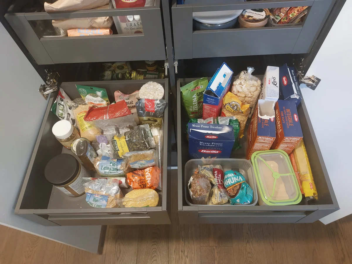 Kitchen drawers full of bags of pasta, rice and seeds, before the kitchen was organized