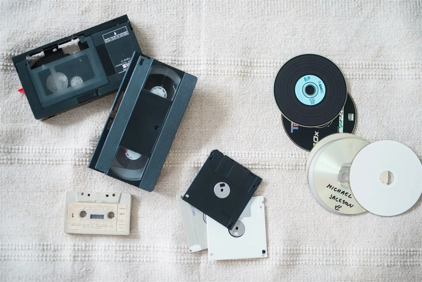 VHS tapes, an audio cassette, floppy disks and CDs laid out together — VHS, DVD and CD digitalization in Zagreb