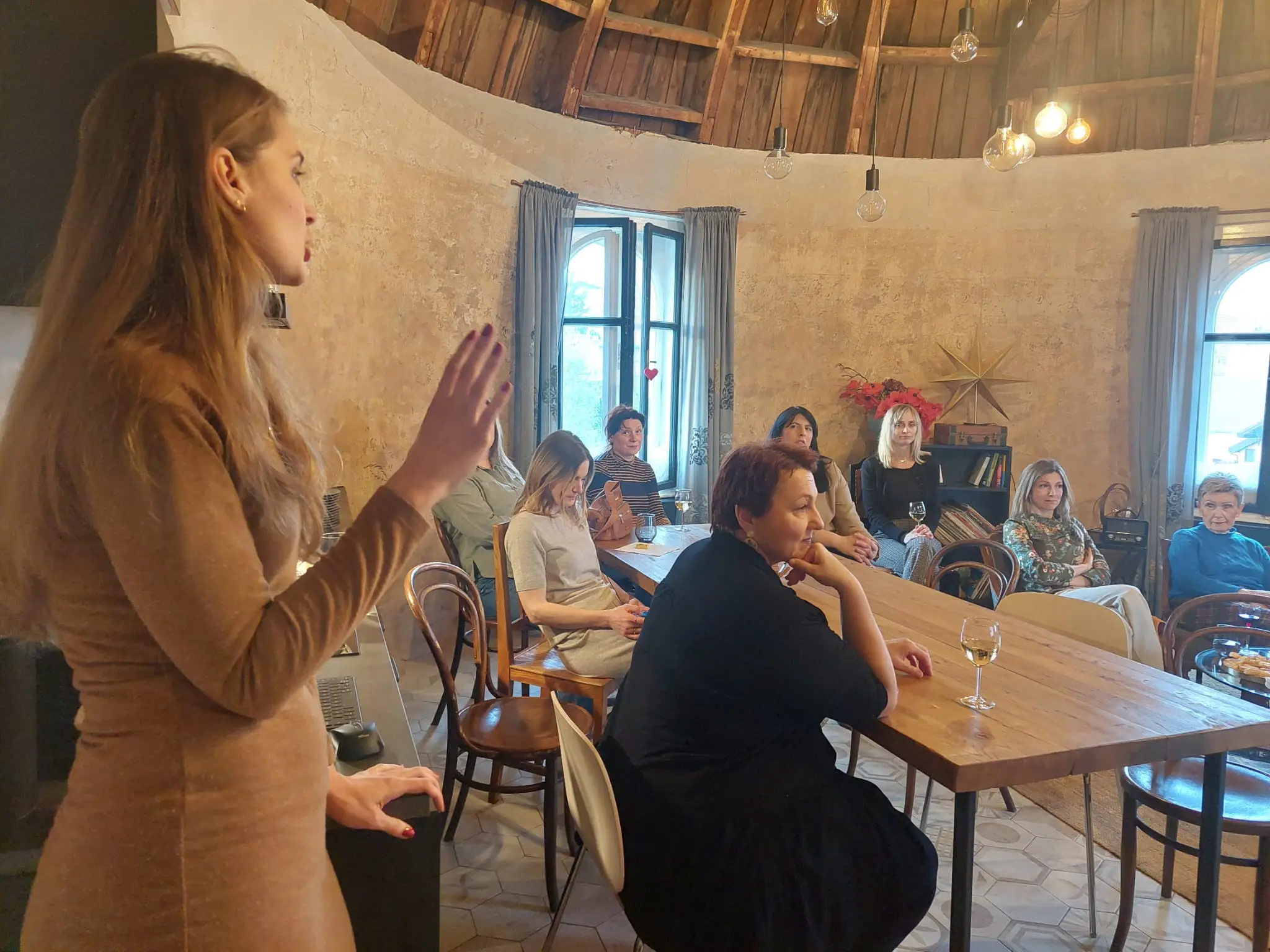 A wardrobe workshop for a small group at Kupola in Zagreb, everyone seated around one table