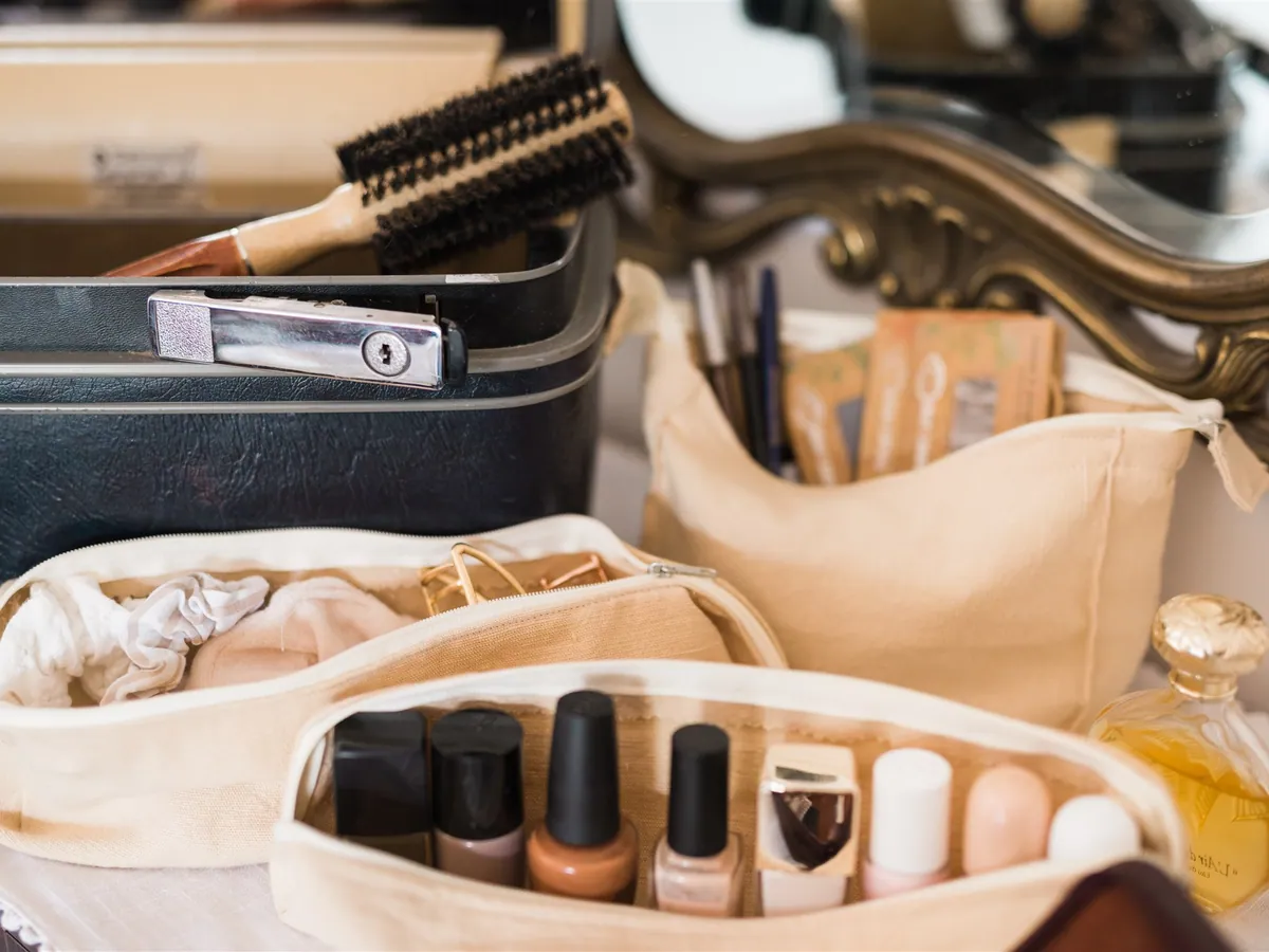 Cloth pouches with nail polish and a manicure set on a dresser